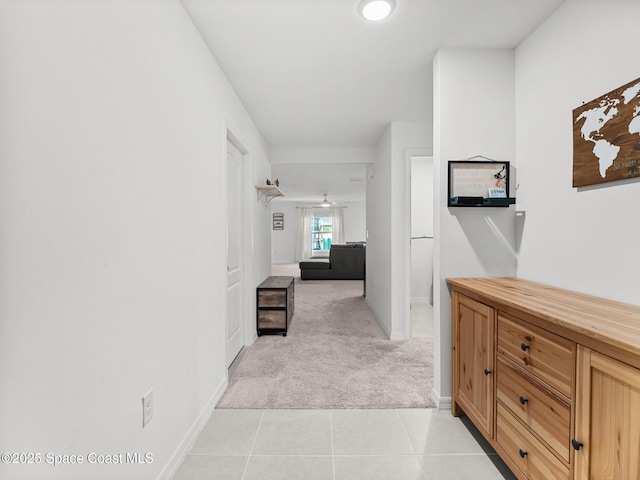 2926 Tishman Rd SE, Palm Bay, FL 32909 - hallway featuring light colored carpet and light tile patterned floors