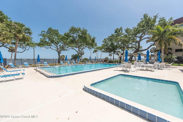 1049 Rockledge Dr Unit 507B, Rockledge, FL 32955 - community pool with a patio