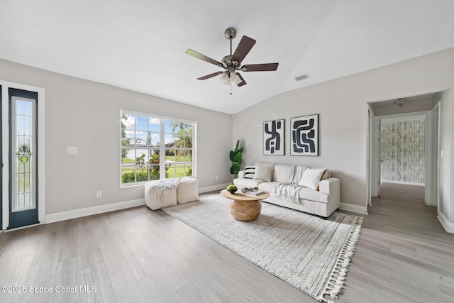 897 Hunters Creek Dr, Melbourne, FL 32904 - living room with light wood-type flooring, a ceiling fan, and vaulted ceiling