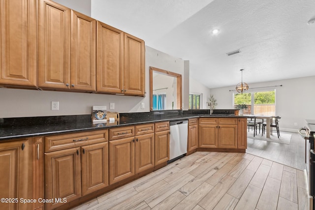 897 Hunters Creek Dr, Melbourne, FL 32904 - kitchen featuring dishwasher, vaulted ceiling, light wood-style floors, brown cabinetry, and pendant lighting