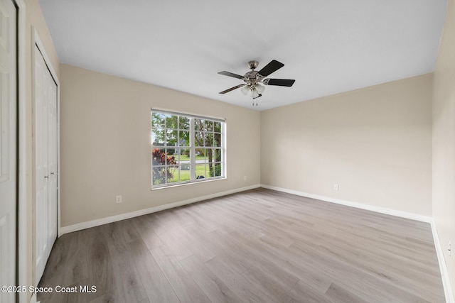 897 Hunters Creek Dr, Melbourne, FL 32904 - unfurnished bedroom featuring wood finished floors, a closet, and ceiling fan