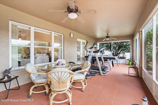 4808 Springwater Cir, Melbourne, FL 32940 - sunroom with outdoor dining area, a ceiling fan, and plenty of natural light
