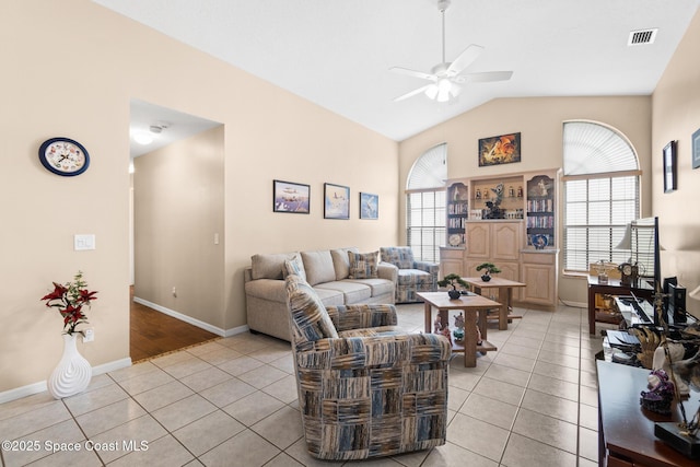 4808 Springwater Cir, Melbourne, FL 32940 - living area with light tile patterned floors, a ceiling fan, and lofted ceiling