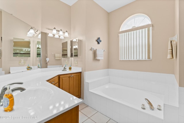 4808 Springwater Cir, Melbourne, FL 32940 - bathroom featuring a bath, double vanity, and tile patterned flooring
