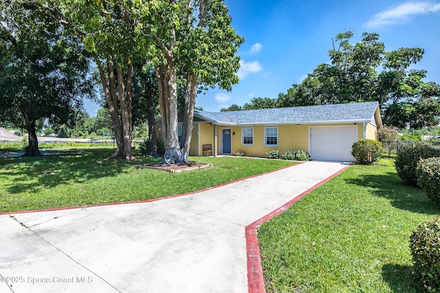 3384 Elizabeth St, West Melbourne, FL 32904 - ranch-style house with driveway and an attached garage