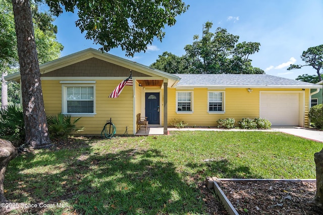 3384 Elizabeth St, West Melbourne, FL 32904 - view of front of house with a garage, a front lawn, and concrete driveway