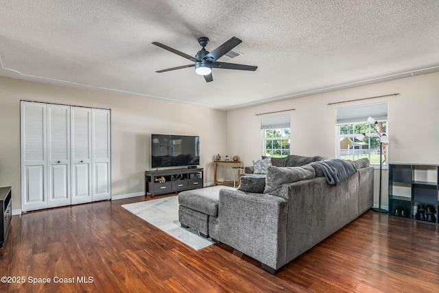 3384 Elizabeth St, West Melbourne, FL 32904 - living room featuring a ceiling fan, wood finished floors, and a textured ceiling