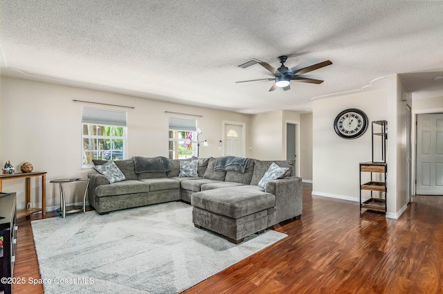 3384 Elizabeth St, West Melbourne, FL 32904 - living area with ceiling fan, a textured ceiling, and wood finished floors