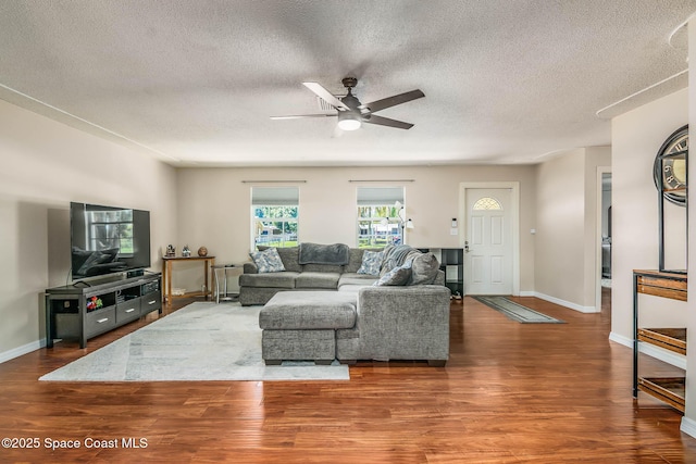 3384 Elizabeth St, West Melbourne, FL 32904 - living area with ceiling fan, wood finished floors, and a textured ceiling
