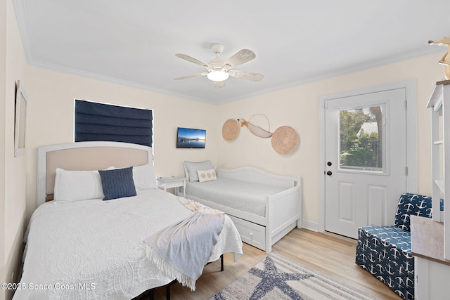 430 Watts Way, Cocoa Beach, FL 32931 - bedroom with light wood-style floors, crown molding, and ceiling fan