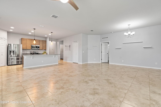 416 Ladyslipper St, Palm Bay, FL 32908 - unfurnished living room featuring light tile patterned floors, recessed lighting, a chandelier, and ceiling fan