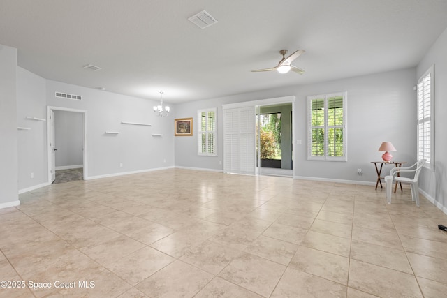 416 Ladyslipper St, Palm Bay, FL 32908 - spare room featuring a chandelier, healthy amount of natural light, and light tile patterned floors
