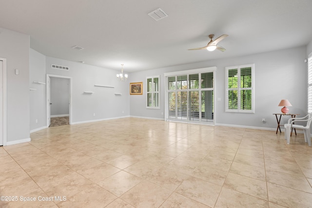 416 Ladyslipper St, Palm Bay, FL 32908 - empty room featuring a ceiling fan, a chandelier, and light tile patterned floors