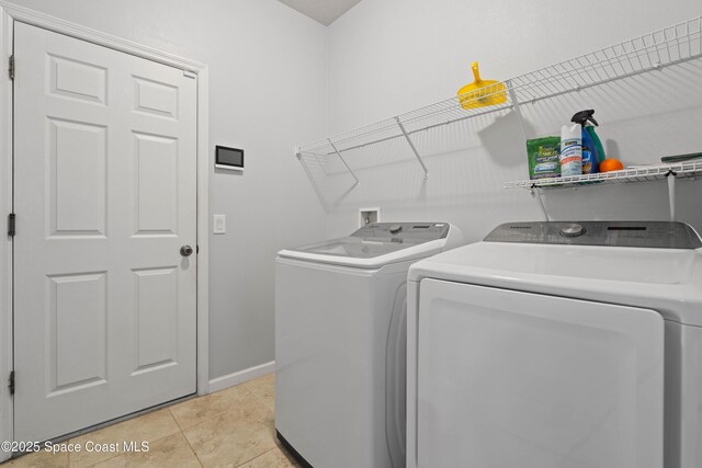 416 Ladyslipper St, Palm Bay, FL 32908 - washroom featuring independent washer and dryer and light tile patterned floors