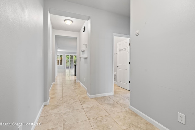 416 Ladyslipper St, Palm Bay, FL 32908 - corridor featuring light tile patterned floors and baseboards