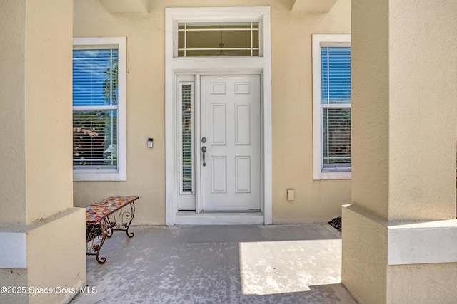 143 Sanibel Way, Melbourne Beach, FL 32951 - property entrance with stucco siding