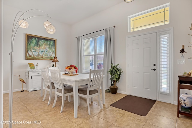 143 Sanibel Way, Melbourne Beach, FL 32951 - dining space with light tile patterned floors and baseboards