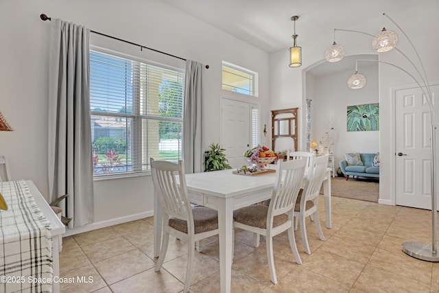 143 Sanibel Way, Melbourne Beach, FL 32951 - dining area featuring light tile patterned flooring and baseboards