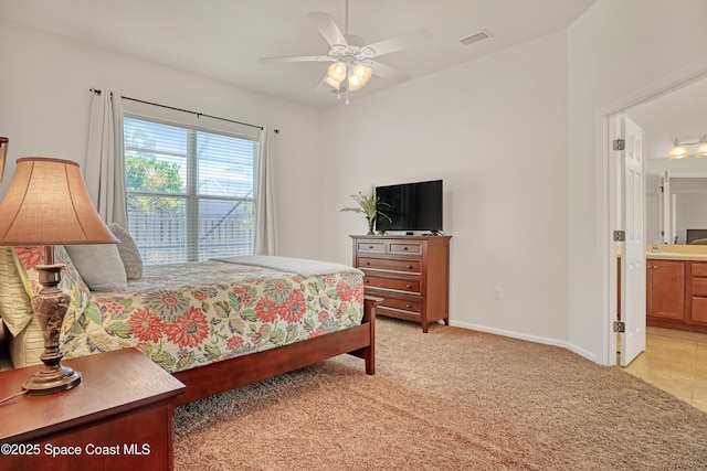143 Sanibel Way, Melbourne Beach, FL 32951 - bedroom featuring light carpet, ensuite bath, and ceiling fan