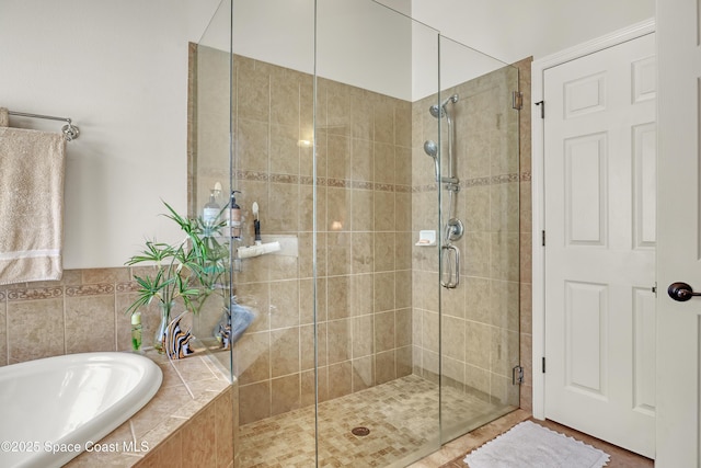 143 Sanibel Way, Melbourne Beach, FL 32951 - bathroom with a bath and a stall shower