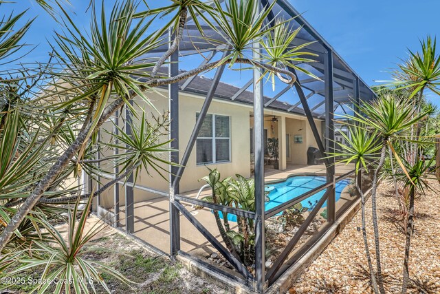 143 Sanibel Way, Melbourne Beach, FL 32951 - swimming pool featuring a lanai and a patio