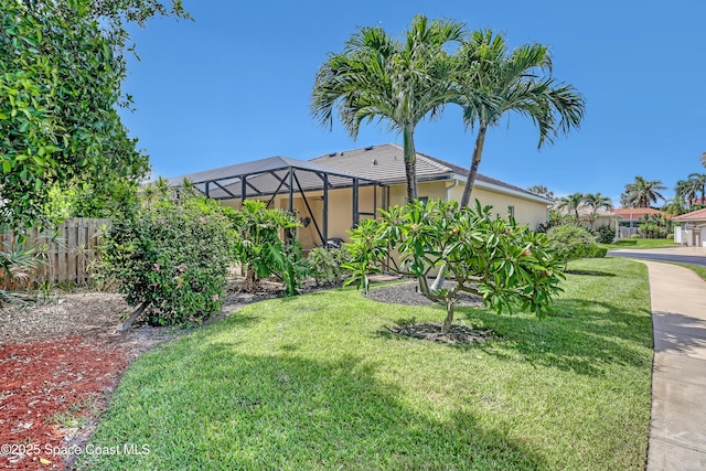 143 Sanibel Way, Melbourne Beach, FL 32951 - view of yard with glass enclosure