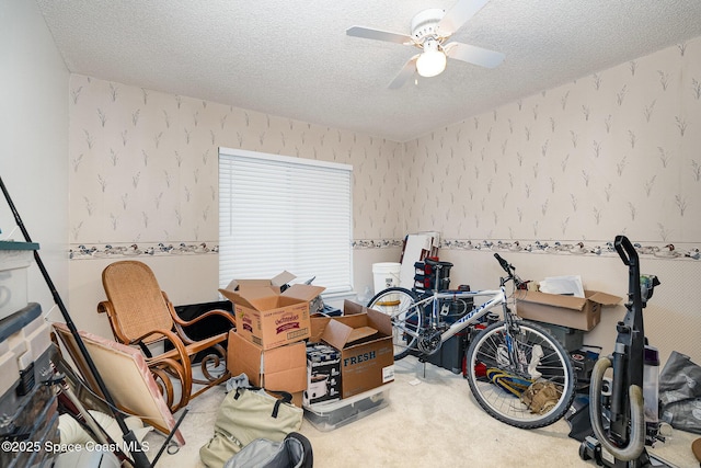 1515 Huntington Ln Unit 423, Rockledge, FL 32955 - game room featuring wallpapered walls, a textured ceiling, ceiling fan, and carpet flooring