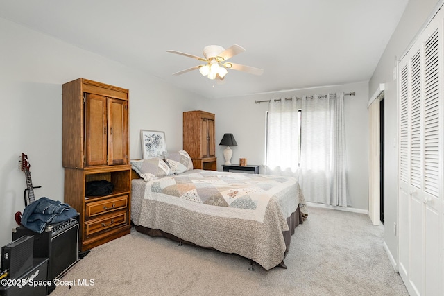 1515 Huntington Ln Unit 423, Rockledge, FL 32955 - bedroom featuring a closet, light carpet, and a ceiling fan