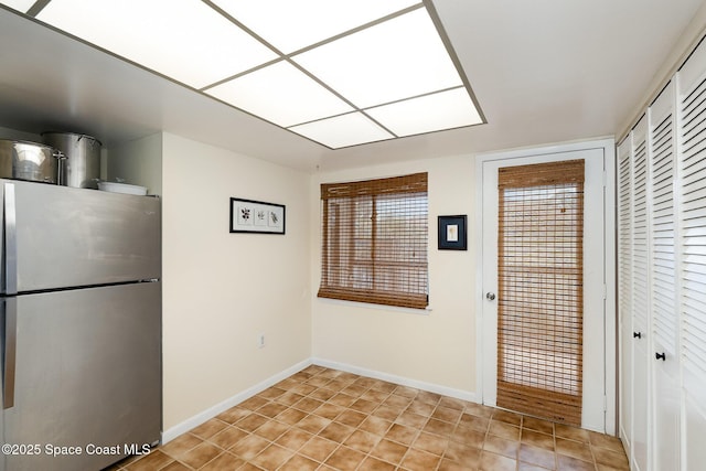 1515 Huntington Ln Unit 423, Rockledge, FL 32955 - kitchen featuring freestanding refrigerator and light tile patterned flooring