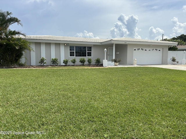 545 Teakwood Ave, Satellite Beach, FL 32937 - ranch-style home with a garage, driveway, and stucco siding