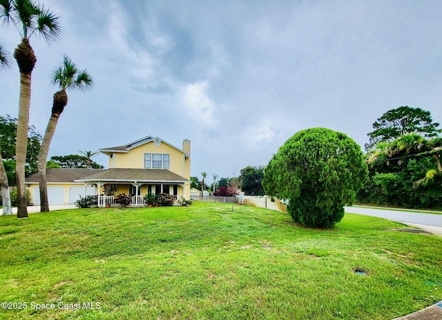 4200 Lee Hall Pl, Cocoa, FL 32927 - view of yard with covered porch and a garage