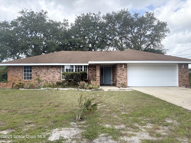 704 Cavio Ave NE, Palm Bay, FL 32905 - ranch-style home with an attached garage, concrete driveway, brick siding, and a front yard