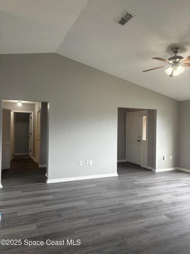 704 Cavio Ave NE, Palm Bay, FL 32905 - empty room featuring vaulted ceiling, a ceiling fan, and wood finished floors