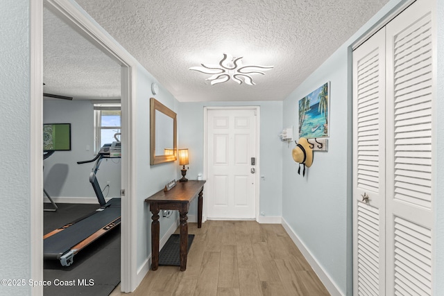 2815 S Atlantic Ave Unit 606, Cocoa Beach, FL 32931 - entryway featuring light wood-style floors and a textured ceiling