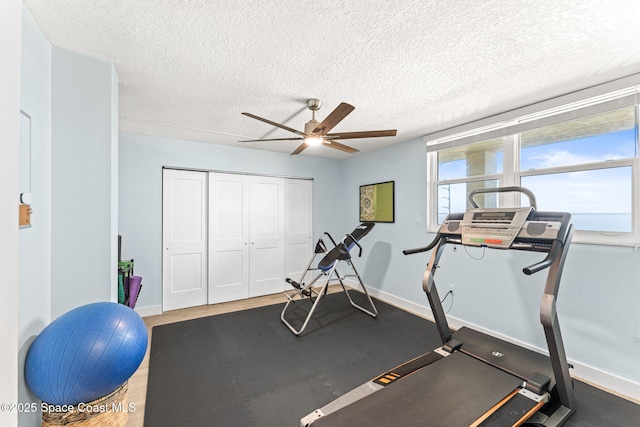 2815 S Atlantic Ave Unit 606, Cocoa Beach, FL 32931 - exercise room with ceiling fan and a textured ceiling
