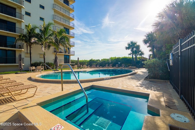 2815 S Atlantic Ave Unit 606, Cocoa Beach, FL 32931 - community pool with a patio area and a community hot tub