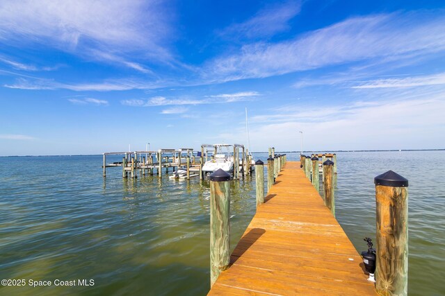 2815 S Atlantic Ave Unit 606, Cocoa Beach, FL 32931 - dock area with a water view and boat lift