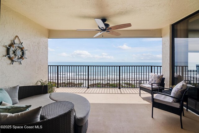 2815 S Atlantic Ave Unit 606, Cocoa Beach, FL 32931 - balcony with ceiling fan and view of water and beach