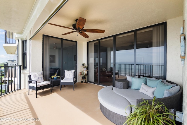2815 S Atlantic Ave Unit 606, Cocoa Beach, FL 32931 - patio / terrace featuring ceiling fan and an outdoor living space