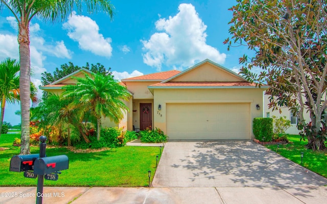 758 Carriage Lake Way, Vero Beach, FL 32968 - view of front facade with stucco siding, a front lawn, concrete driveway, and a garage