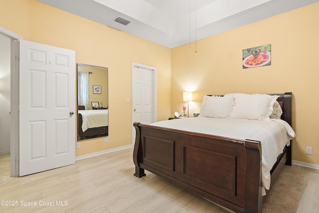 758 Carriage Lake Way, Vero Beach, FL 32968 - bedroom with light wood-type flooring and baseboards