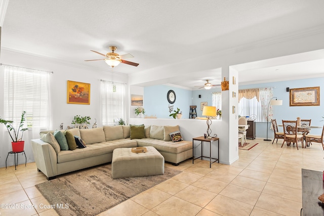 758 Carriage Lake Way, Vero Beach, FL 32968 - living area featuring ceiling fan, light tile patterned floors, and ornamental molding