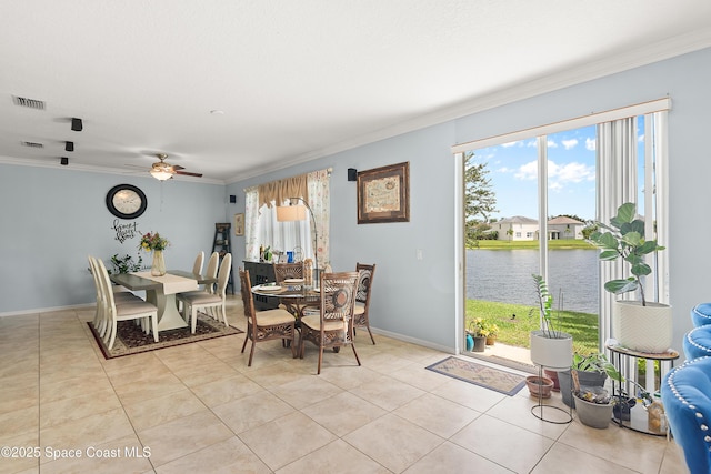 758 Carriage Lake Way, Vero Beach, FL 32968 - dining area with a water view, ornamental molding, ceiling fan, and light tile patterned floors