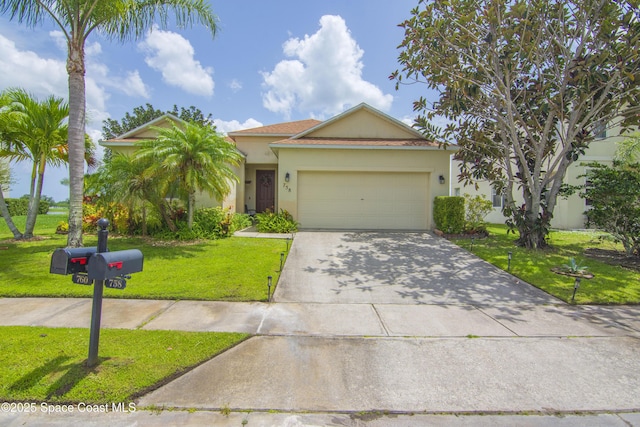 758 Carriage Lake Way, Vero Beach, FL 32968 - view of front of home featuring stucco siding, a front yard, concrete driveway, and an attached garage