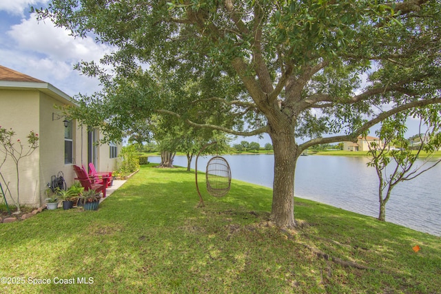 758 Carriage Lake Way, Vero Beach, FL 32968 - view of green lawn featuring a water view
