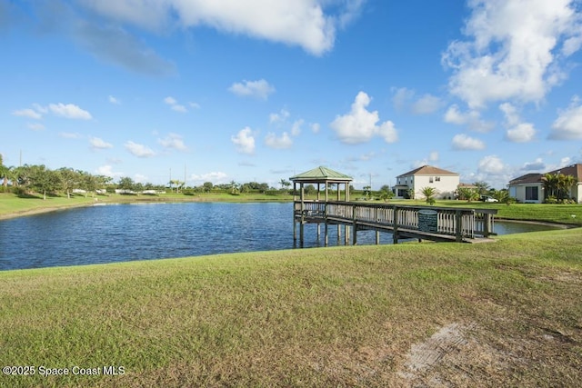 758 Carriage Lake Way, Vero Beach, FL 32968 - dock area featuring a gazebo, a lawn, and a water view