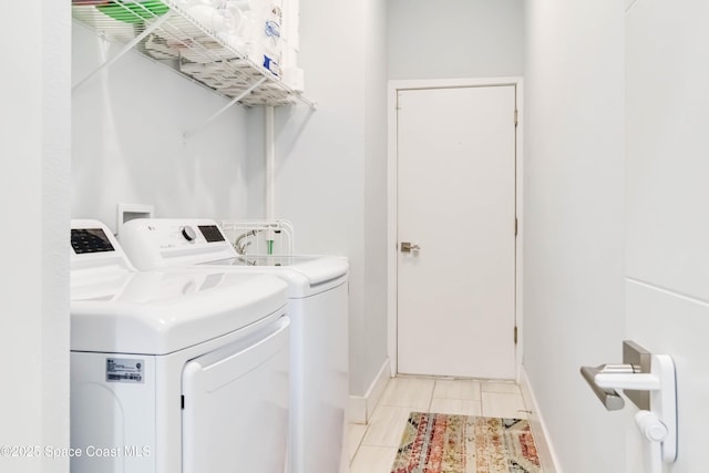 2840 Fontainebleau Ave SE, Palm Bay, FL 32909 - laundry area featuring washer and dryer and light tile patterned floors