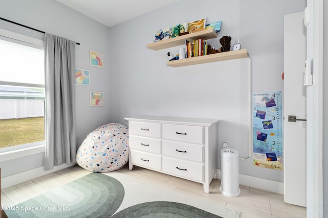 2840 Fontainebleau Ave SE, Palm Bay, FL 32909 - bedroom featuring light tile patterned floors and baseboards