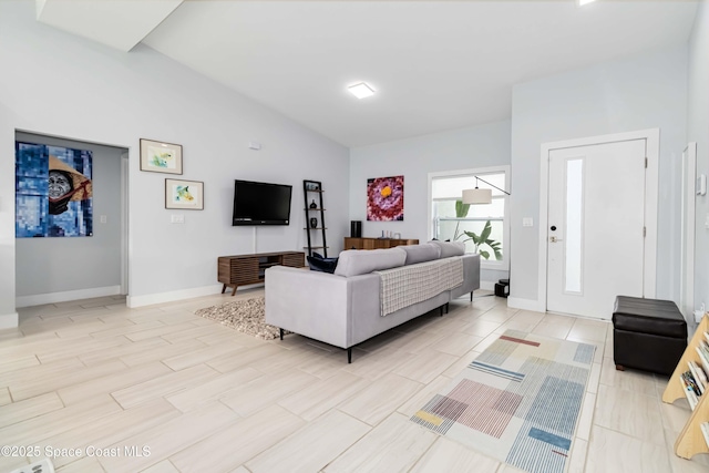 2840 Fontainebleau Ave SE, Palm Bay, FL 32909 - living room with vaulted ceiling and baseboards