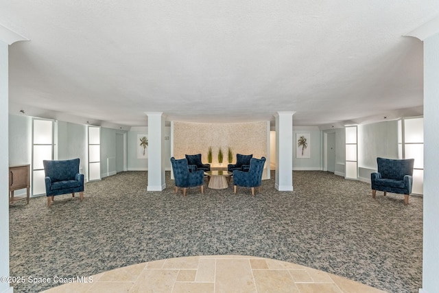 2100 N Atlantic Ave Unit 1110, Cocoa Beach, FL 32931 - carpeted living area with plenty of natural light and decorative columns